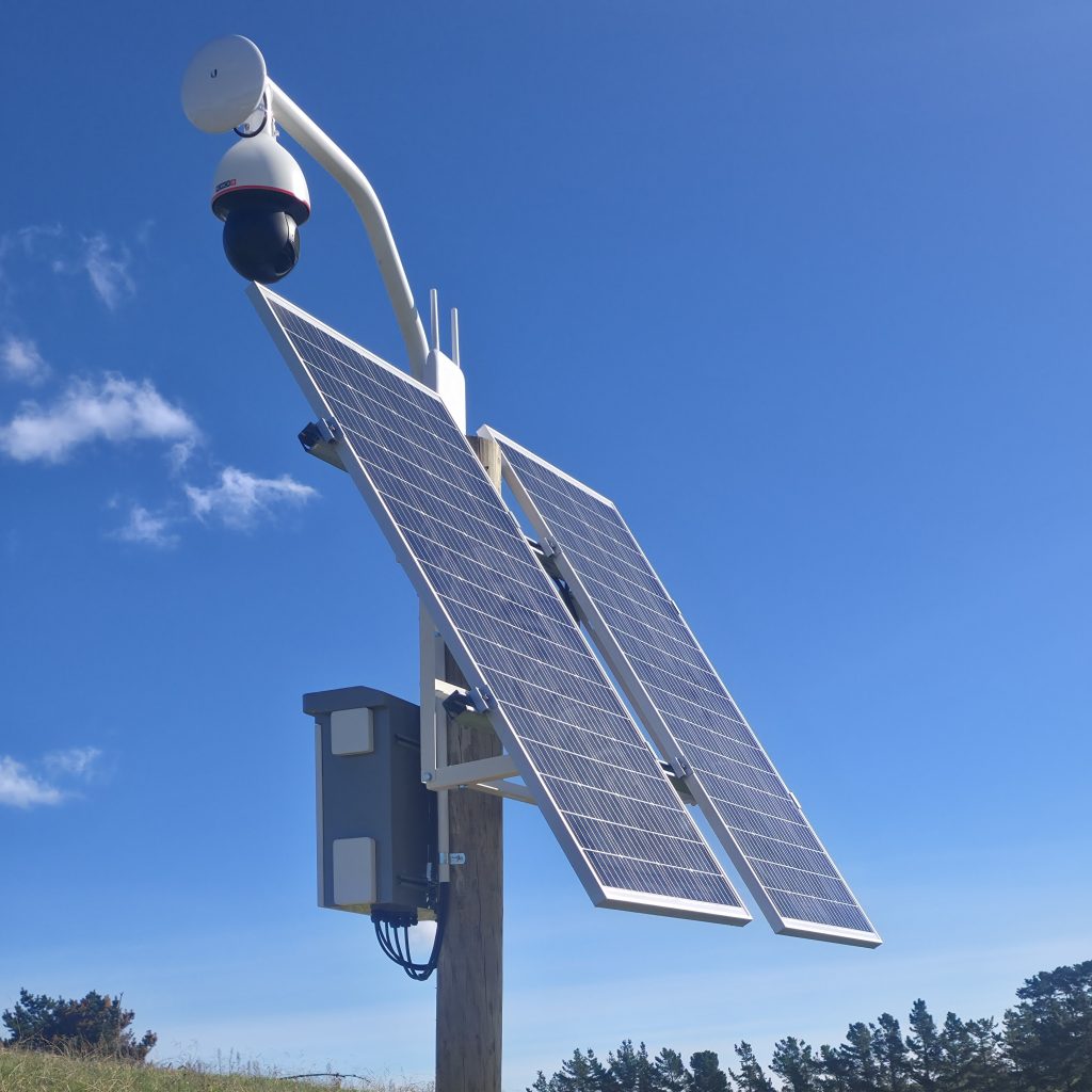 Solar-powered PTZ camera tower on a rural farm